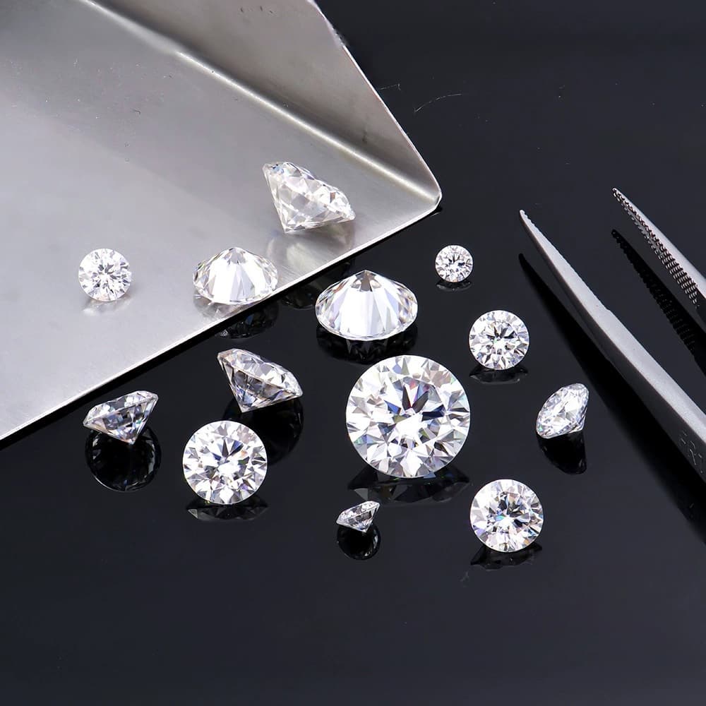 Loose lab-grown diamond stones on a black surface
